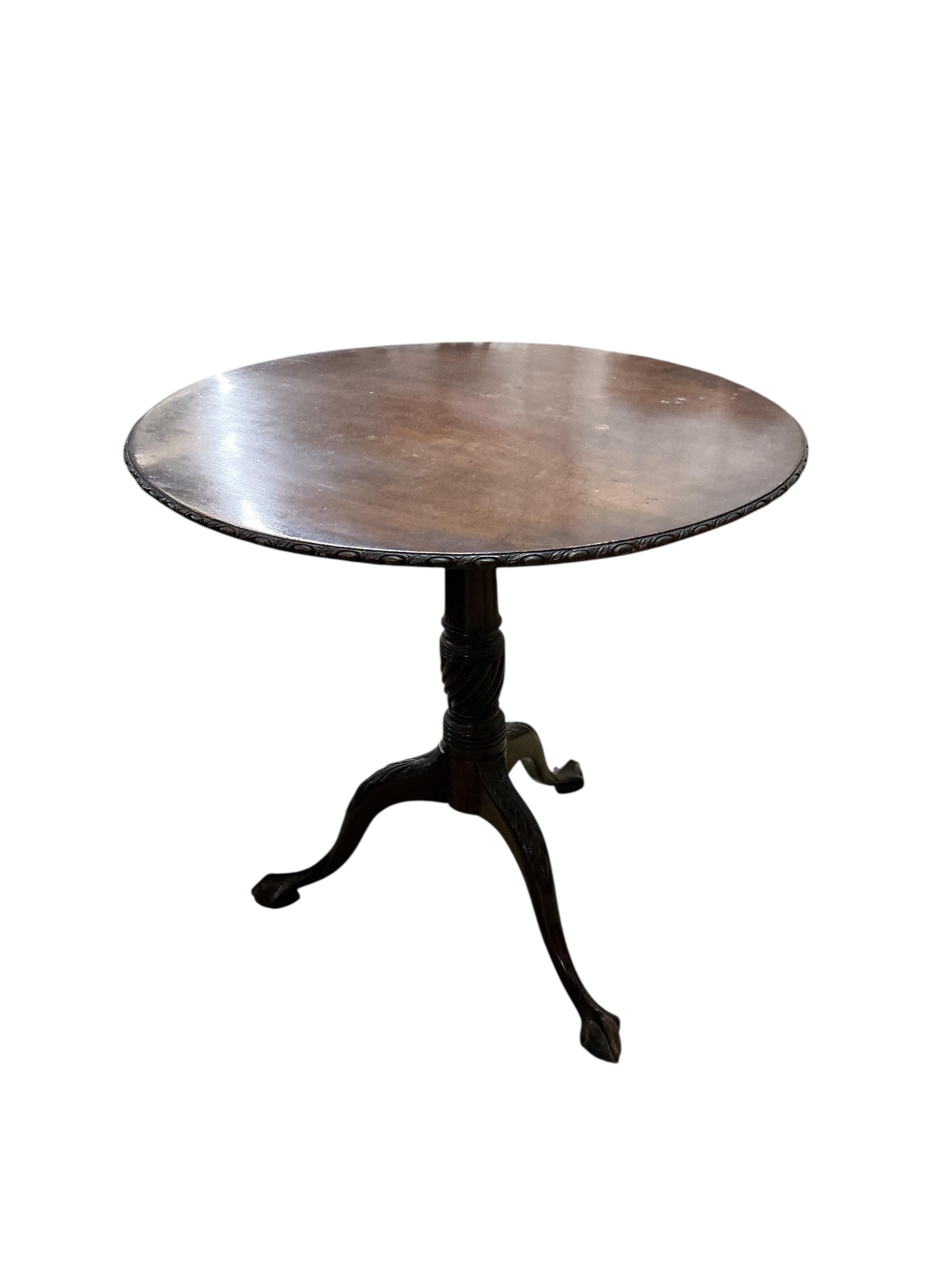 A George III style circular mahogany tilt top tripod tea table, diameter 74cm, height 70cm